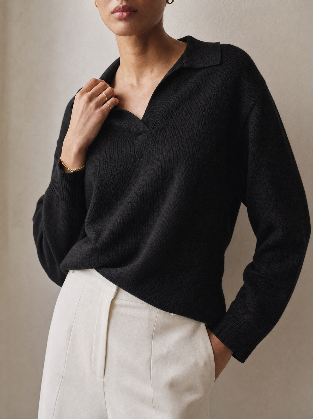Close-up of the Rowa Era Polo Sweater in black