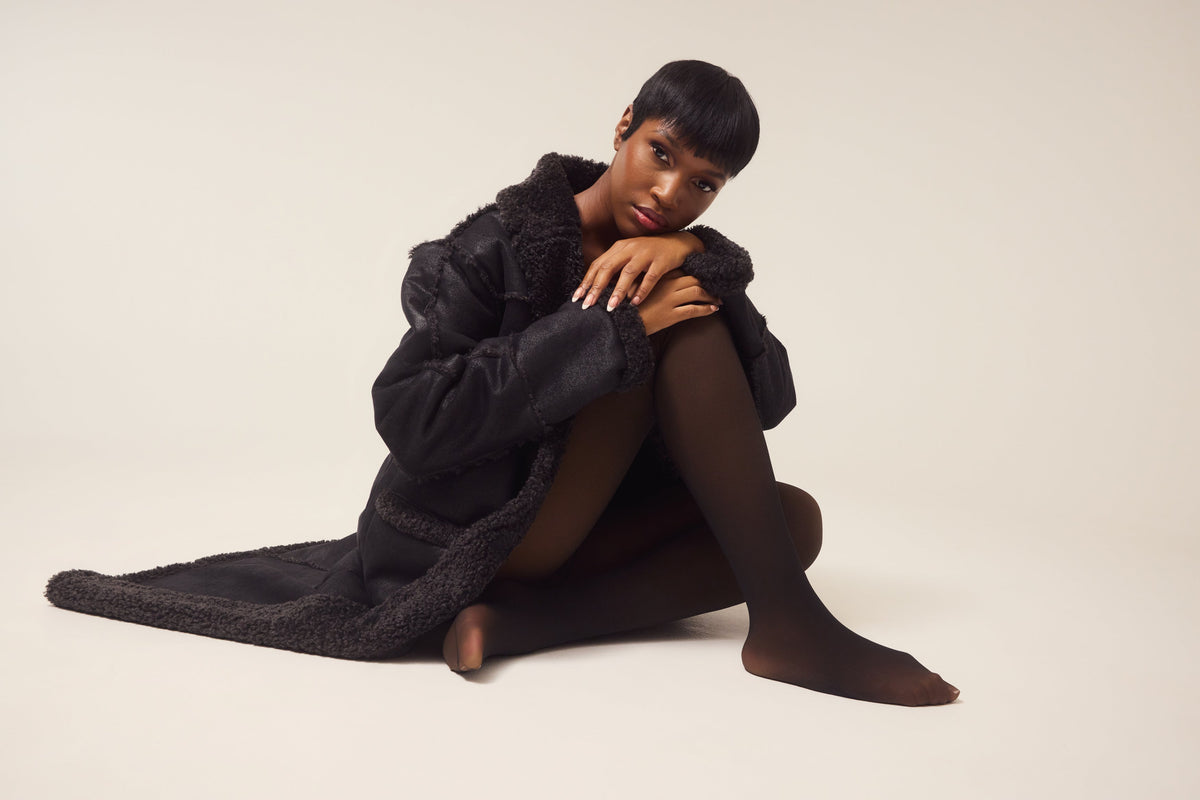 ThermaSculpt tights styled with a coat